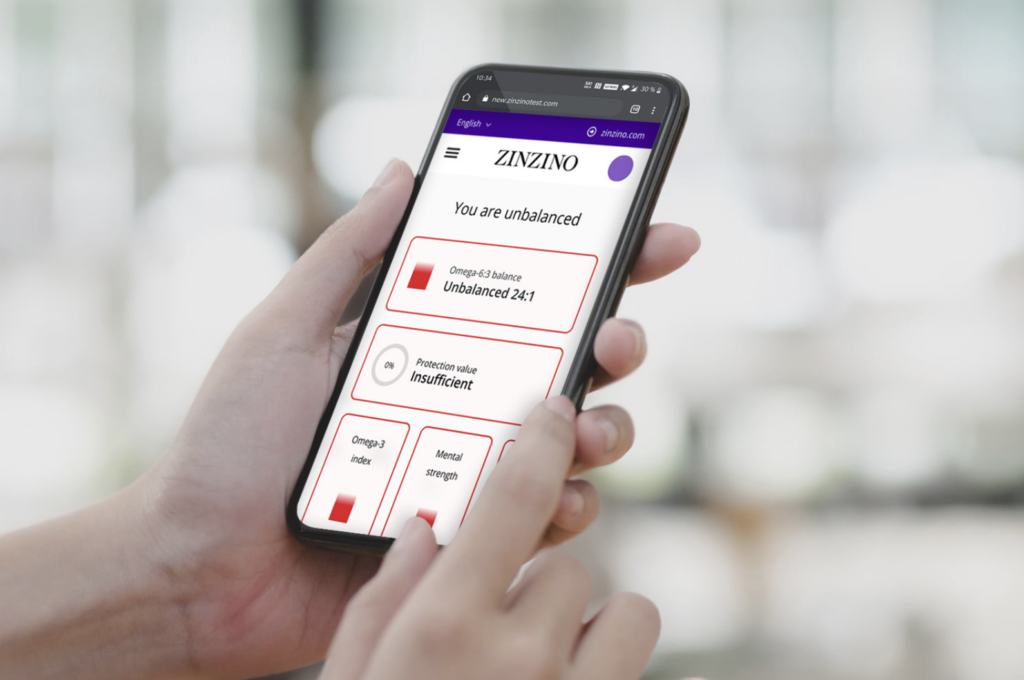 Visuel sur un smartphone qui montre les résultats d'un test de Balance Oil, montrant l'écart entre Oméga 3 et Oméga 6
